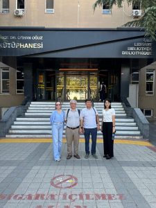 4 people in front of the Marmara University building
